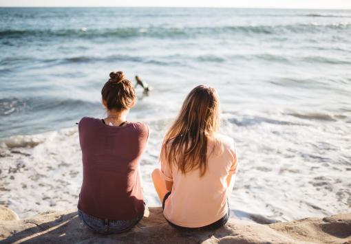 two girls in front of the sea